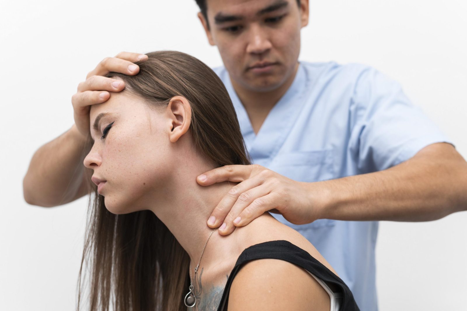 physiotherapist-massaging-woman-s-neck